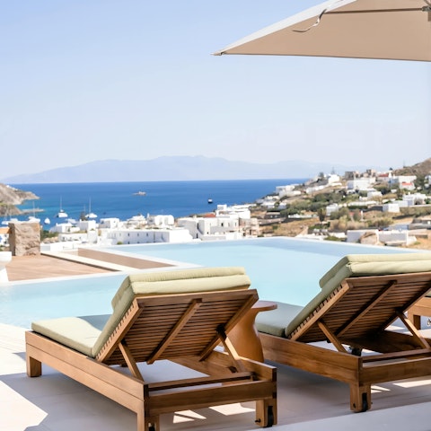 Embrace pure relaxation and beautiful views from the pool
