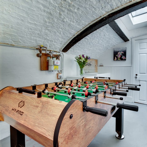 Play a friendly game of table football in the games room