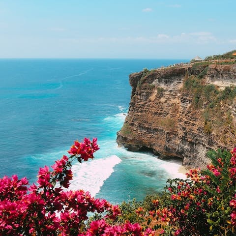 Stay in the Bukit Peninsula, known for its rugged, dramatic scenery and incredible beaches, like the nearby Balangan Beach