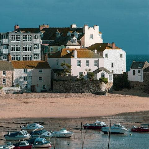 Wander St Ives Harbour's charming quayside, fishing boats, and turquoise waters