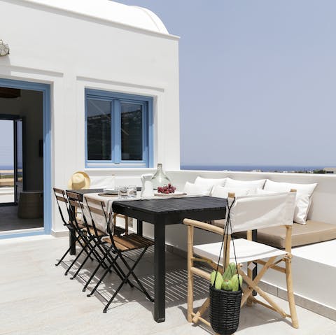 Dig into a Greek mezze against the backdrop of the Santorini sea