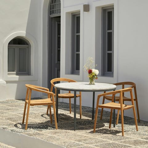 Share alfresco snacks while admiring the caldera views