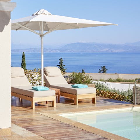 Descend the steps into the plunge pool after sipping cocktails under the umbrellas