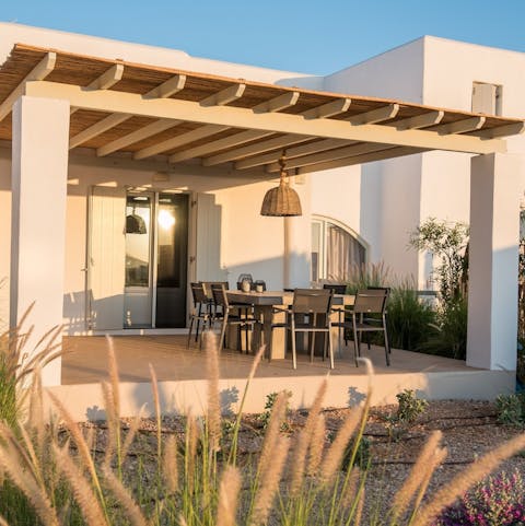 Drink and dine alfresco on the covered terrace – the best place from which to watch the sun sink beneath the waves