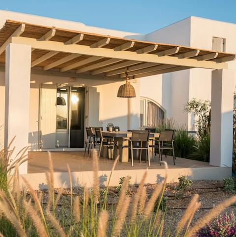 Drink and dine alfresco on the covered terrace – the best place from which to watch the sun sink beneath the waves