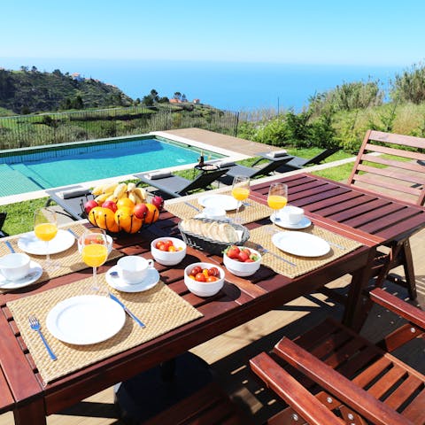 Dine alfresco with a view out to the sea