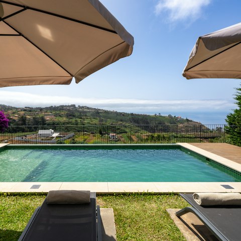 Stretch out by the private pool