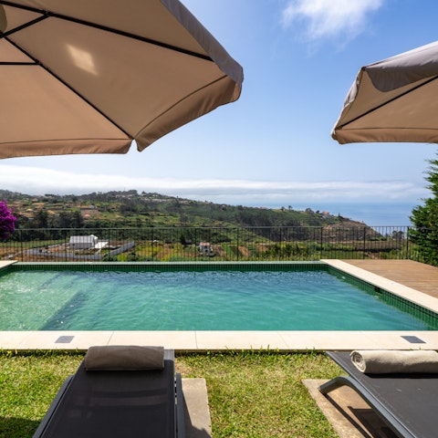 Stretch out by the private pool