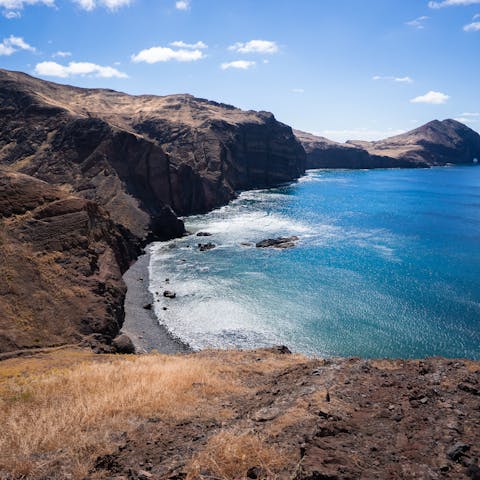 Explore the incredible volcanic black sand beaches