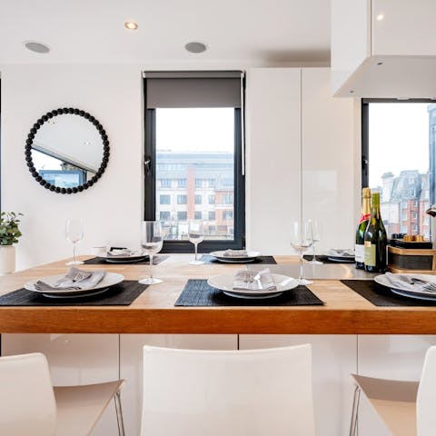 Host a memorable dinner party in the tasteful kitchen and dining area