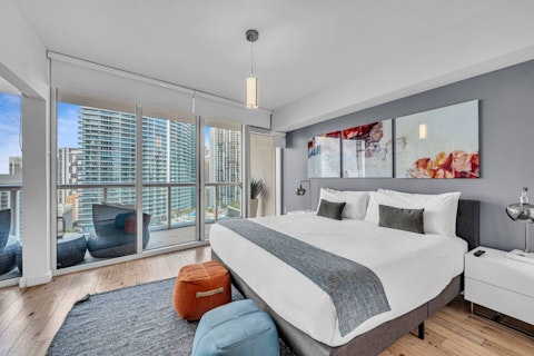 Rise to sweeping city views from the bedroom