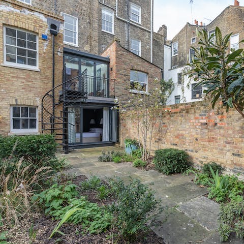 Relax in the private garden on a sunny evening after sightseeing