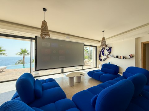 Enjoy movie nights with the terrace and shimmering water just beyond