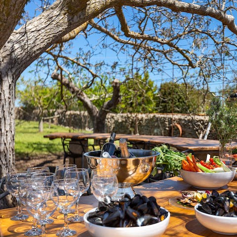 Feast on Puglian delights under the shade of the walnut tree