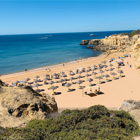 Unwind on Alvor Beach, just a fifteen-minute drive away