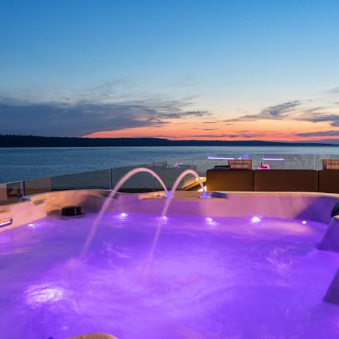 Watch the sunset from the rooftop Jacuzzi