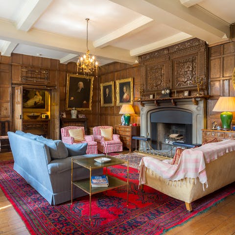 Curl up in the wood-panelled living room