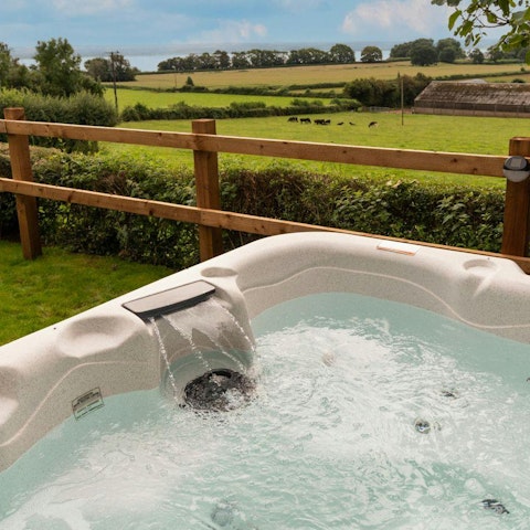 Soak in the private hot tub and take in the views