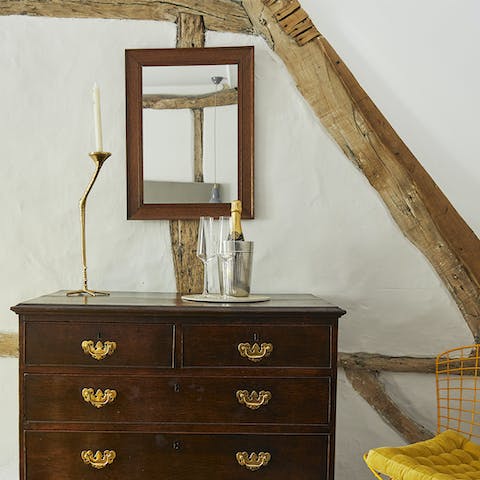 Admire the rustic exposed beams and antique furniture