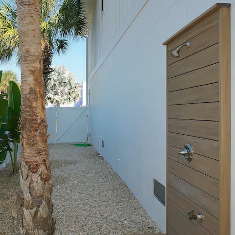 Rinse sandy feet in the outdoor shower after a long afternoon at the beach