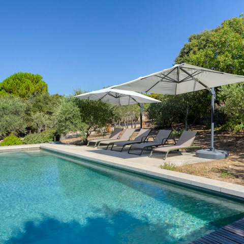 Sink into holiday mode by the hillside pool