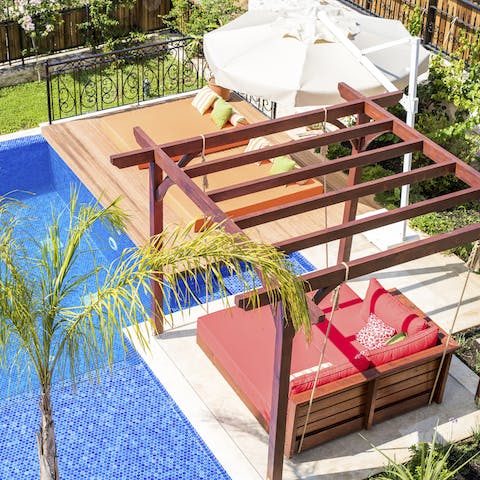 Sip a cool cocktail on one of the luxury day beds