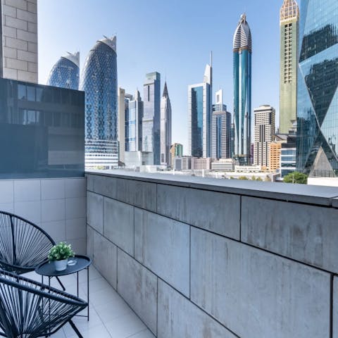 Gaze out at the breathtaking cityscape from your own balcony