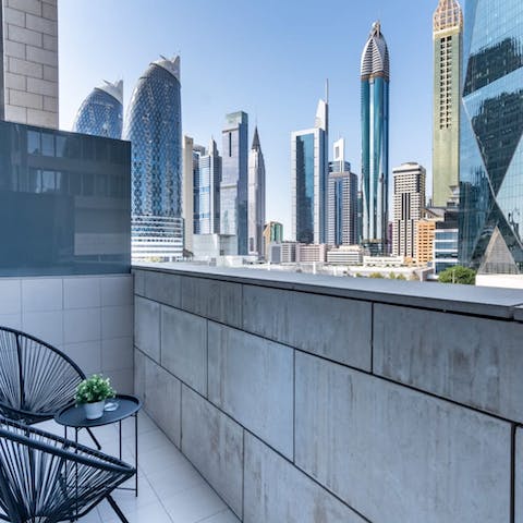 Gaze out at the breathtaking cityscape from your own balcony