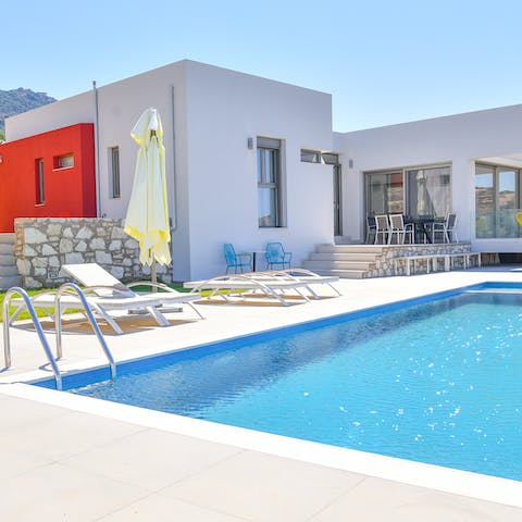 Take a book out to a poolside lounger and enjoy soaking up the sun and the views