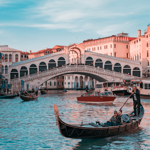 Take a scenic stroll across the Rialto Bridge, a three-minute walk away
