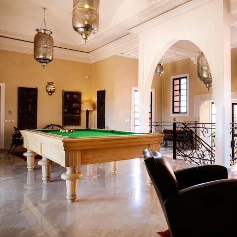 Challenge friends to a game of pool upstairs to round off a busy day