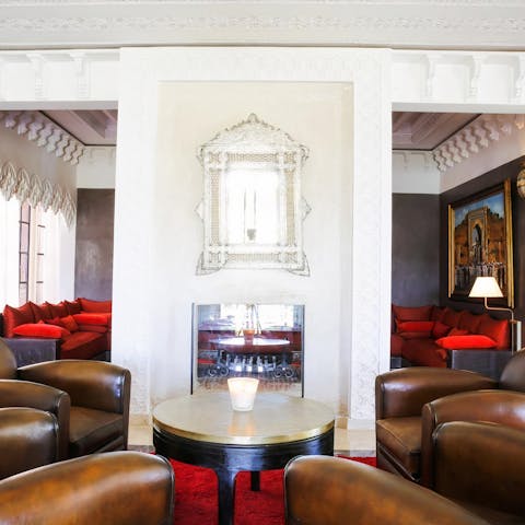 Relax in the traditional Moroccan living area, complete with a cosy fireplace
