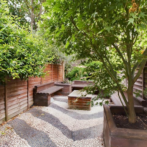 Have a coffee or a wine in the sun in the private garden