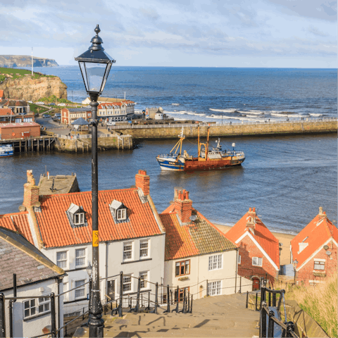 Climb up the 199 steps and watch the boats pull into the harbour