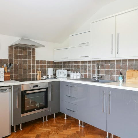 Rustle up a full English breakfast in the sleek kitchen before a day exploring