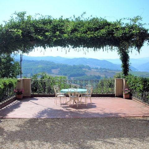 Dine under the pergola with the countryside as your backdrop