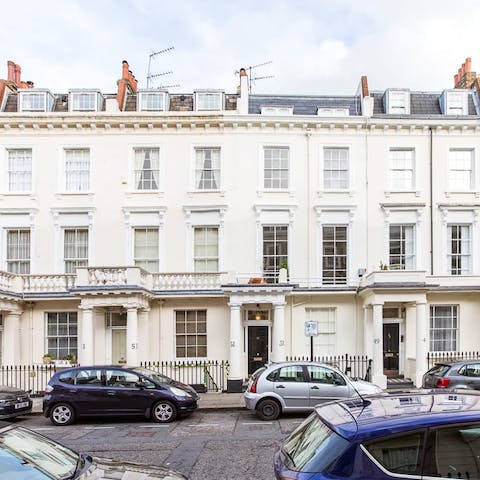 Stay in a beautiful stucco-fronted townhouse