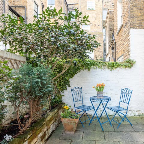 Sip a freshly brewed cup of tea out in the courtyard garden