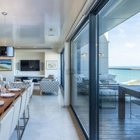 Dine or unwind alongside sea views