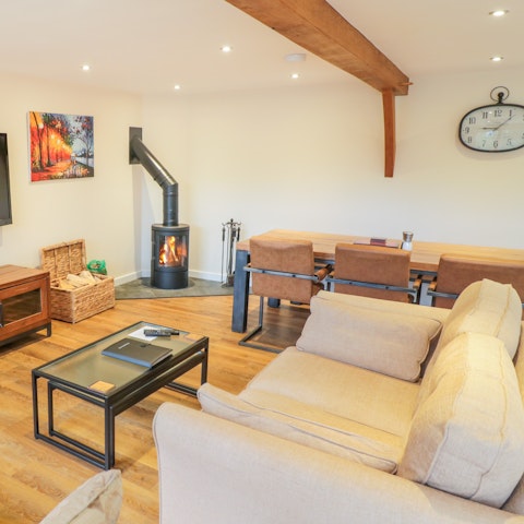 Gather for cosy evenings by the wood-burning fire