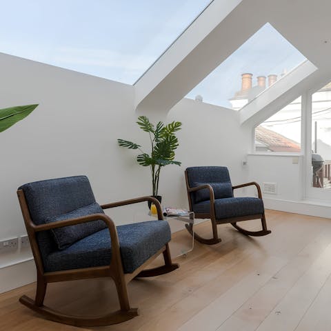 Relax on the mezzanine level with a glass of wine or step out onto the terrace