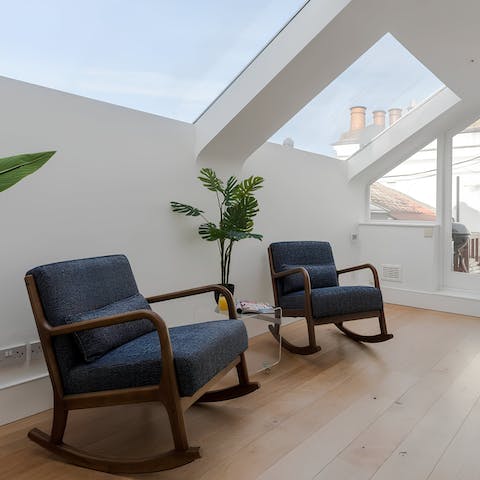 Relax on the mezzanine level with a glass of wine or step out onto the terrace