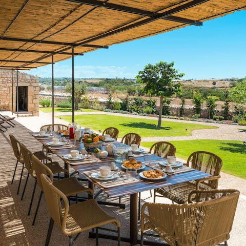 Dine alfresco on the terrace overlooking the rugged countryside
