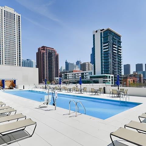 Float above the skyline in the rooftop pool