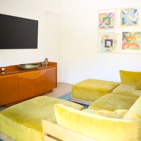 Enjoy movie nights on the plush sofa
