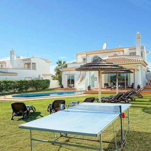 Enjoy a game of table tennis with loved ones in the sunny garden