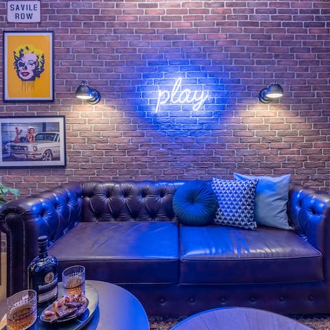 Curl up with a drink in the moody living room