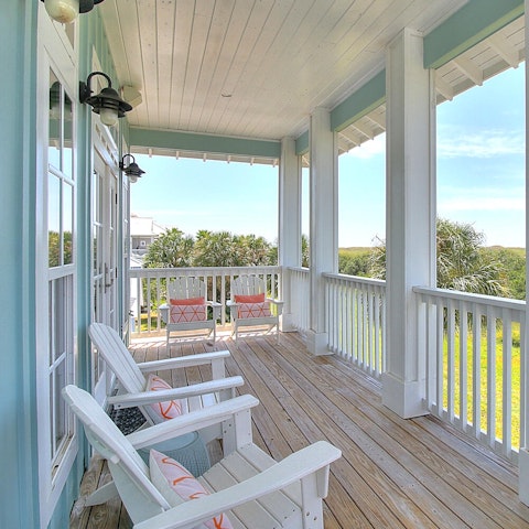 Bask in the coastal setting on the porch