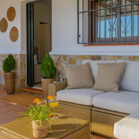 Share an aperitif after a day of exploring the Andalusian coastline