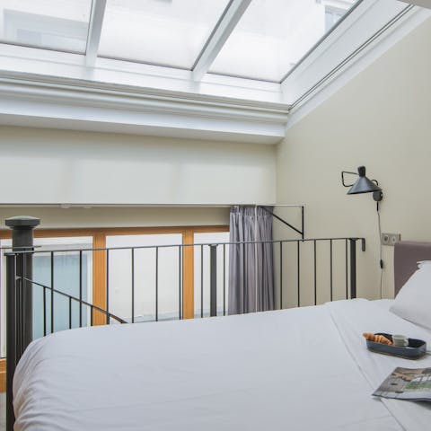 Wake up to sunlight streaming in from the skylight on the mezzanine
